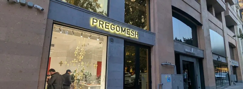 Central Yerevan, October 8, 2026: an illuminated shop window and neighboring commercial premises